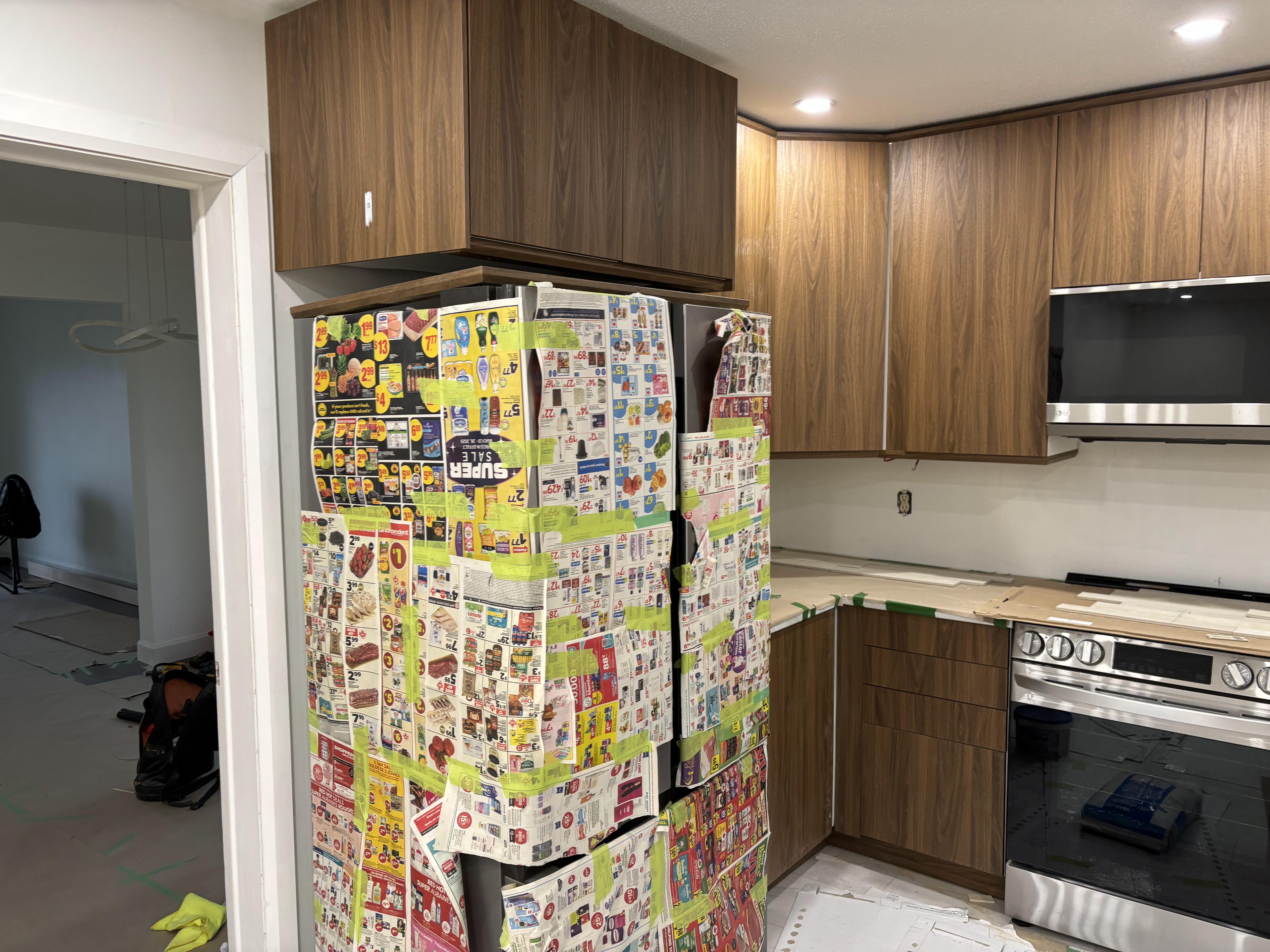 Luxury kitchen renovation Ottawa - dark gray cabinets, marble countertop, geometric backsplash by 613Pro