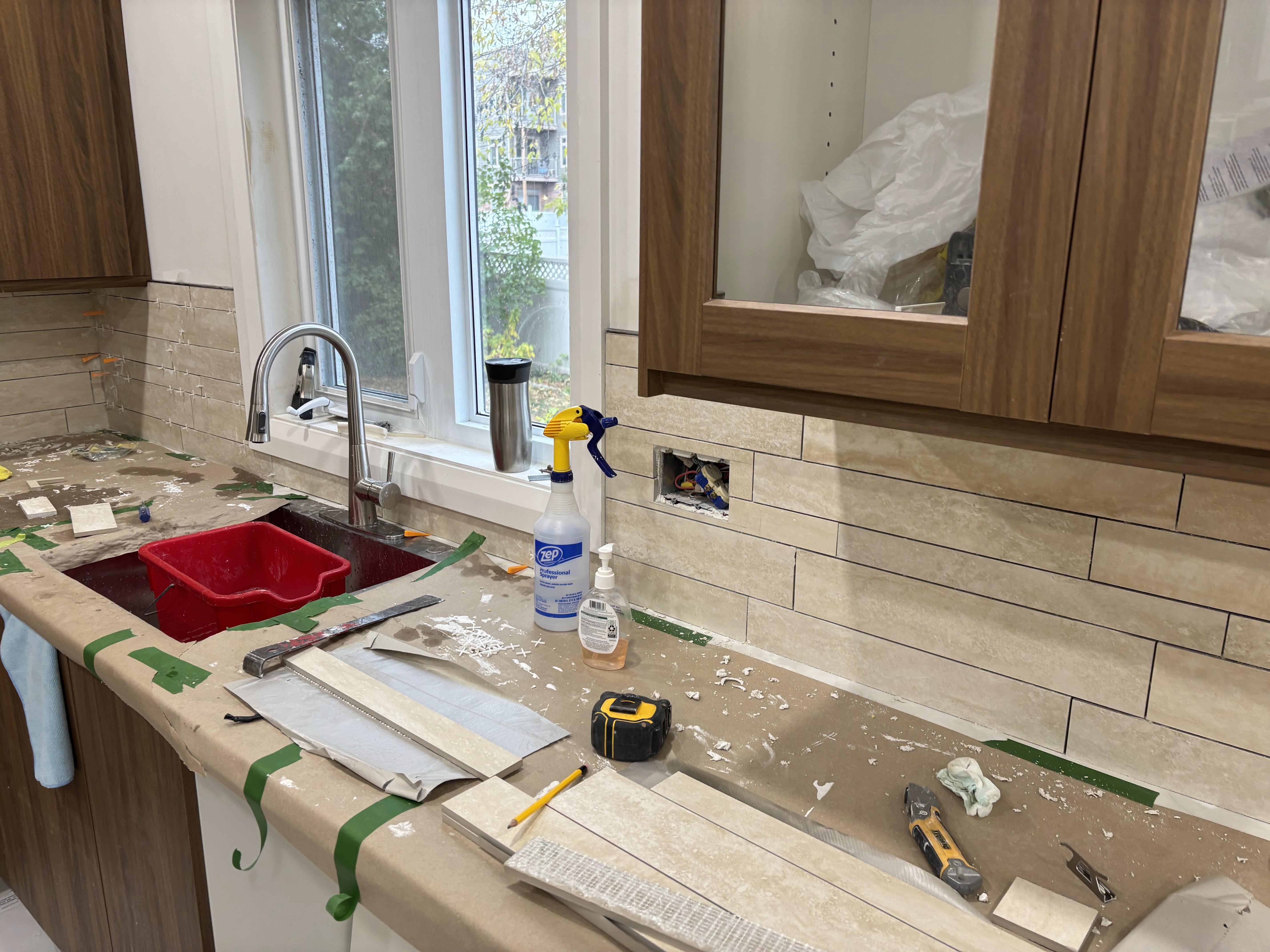 Contemporary kitchen transformation - white cabinets, marble island, pendant lighting by 613Pro